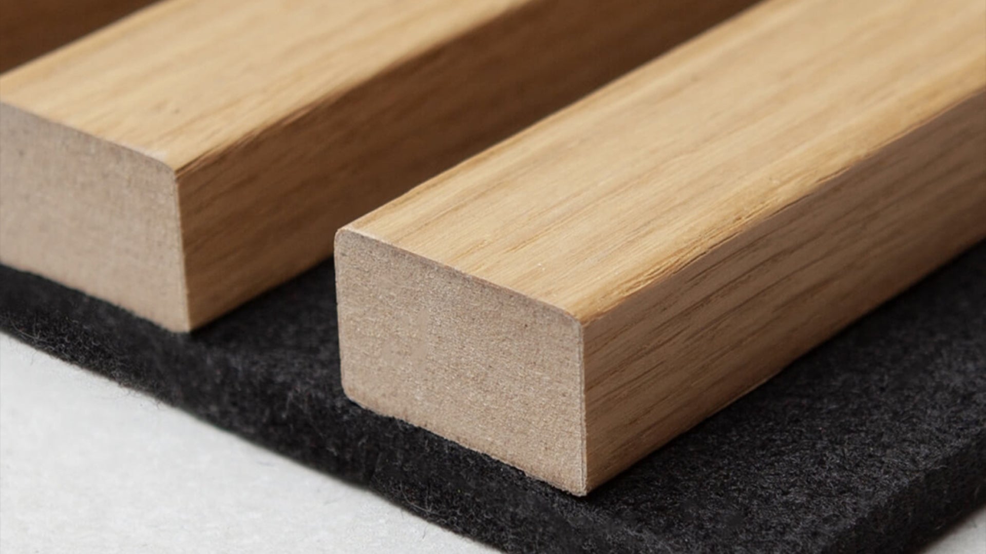 Three-sided wood veneer panel showing wrapped edge detail.